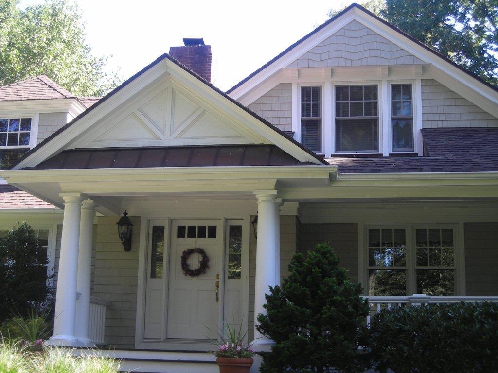 A house with a wreath on the front door.