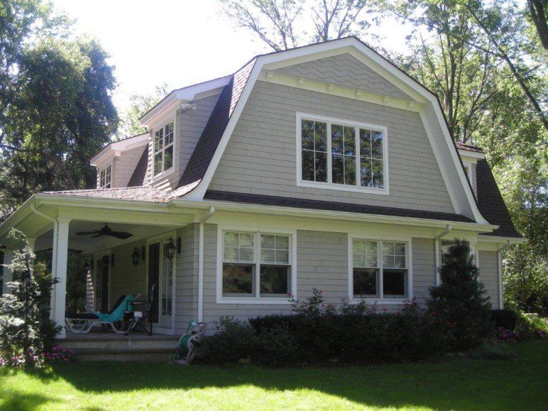 A large house with a lawn chair in front of it.