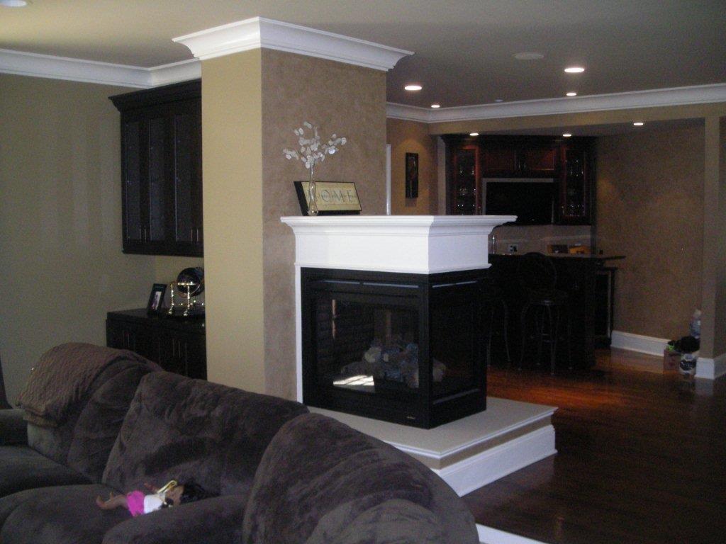 A living room with a fireplace and couch